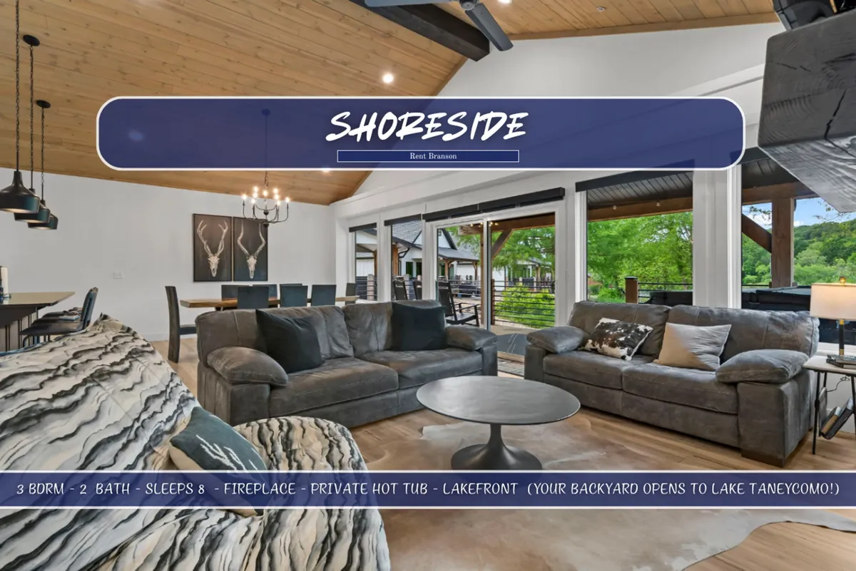 A comfortable seating area featuring large windows that overlook the lake, with stylish light fixtures and a cozy ambiance. The fireplace adds warmth while the expansive windows flood the space with sunlight and offer scenic views of Lake Taneycomo.